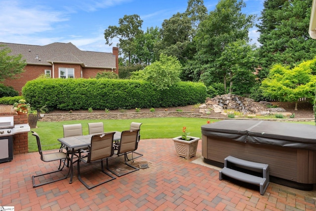 view of patio / terrace with a hot tub and outdoor dining area