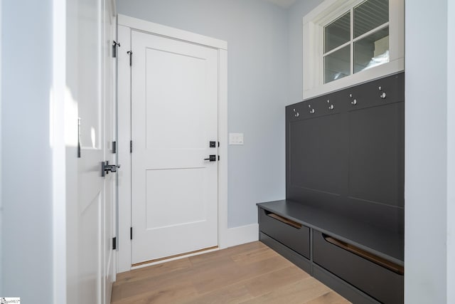 mudroom with baseboards and light wood-type flooring