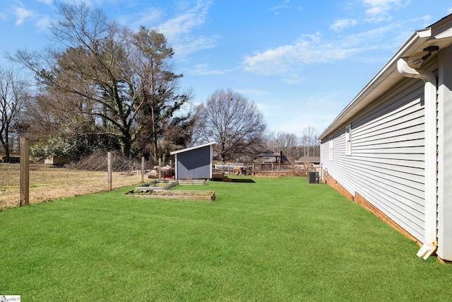 view of yard with cooling unit, a storage shed, an outdoor structure, and fence