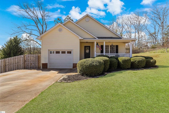 view of front of house with a front lawn, driveway, fence, covered porch, and a garage