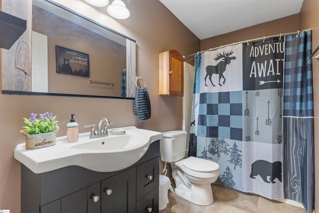 full bath with tile patterned flooring, toilet, vanity, a shower with curtain, and a textured ceiling