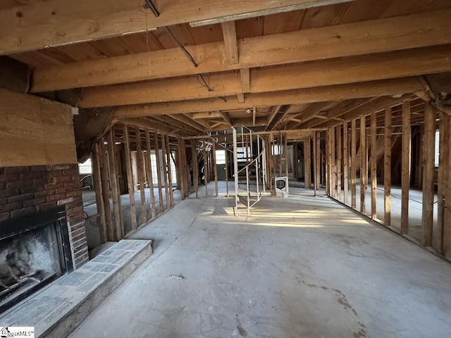 miscellaneous room with a brick fireplace