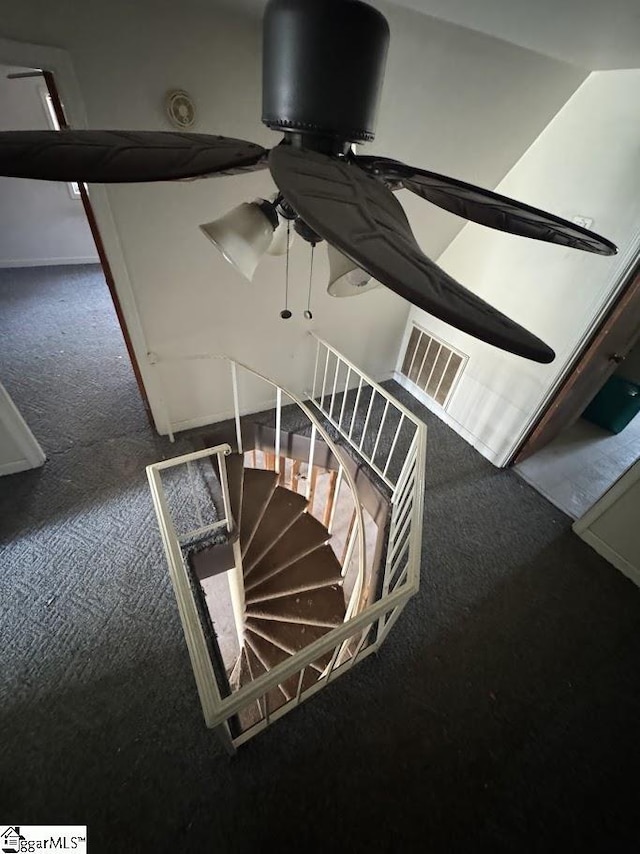 stairway with carpet and visible vents