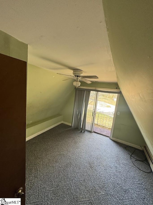 bonus room with vaulted ceiling, baseboards, and carpet floors