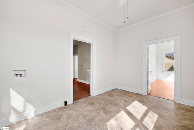 spare room with baseboards, visible vents, and ornamental molding