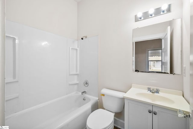 bathroom featuring shower / bathtub combination, toilet, and vanity