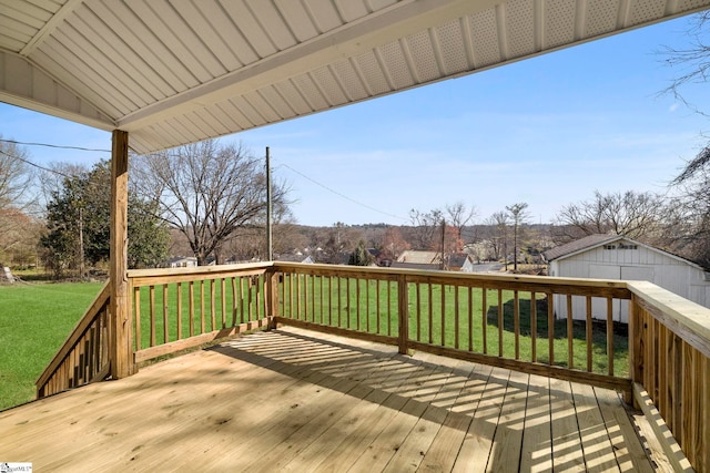 wooden deck featuring a lawn