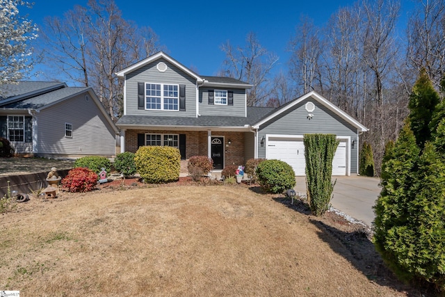 traditional-style house with driveway, roof with shingles, a front lawn, a garage, and brick siding