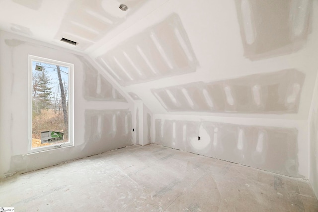 bonus room featuring visible vents and vaulted ceiling