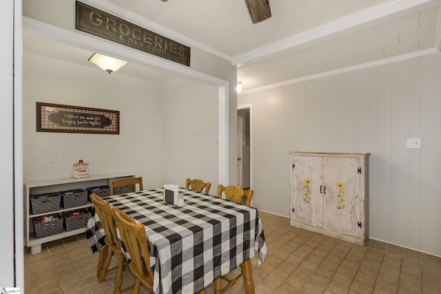 dining area featuring crown molding and a ceiling fan