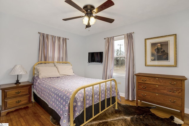 bedroom featuring a ceiling fan and wood finished floors