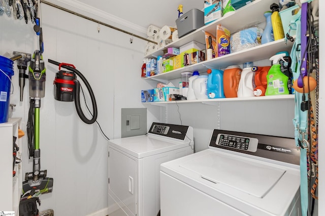 laundry area featuring electric panel, laundry area, and independent washer and dryer