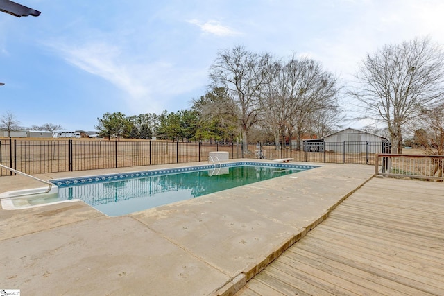 view of swimming pool featuring a patio area, a fenced in pool, and a fenced backyard