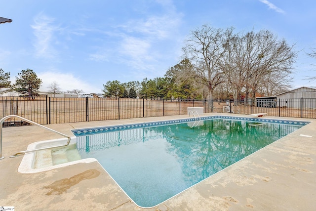 view of pool with a fenced in pool and fence