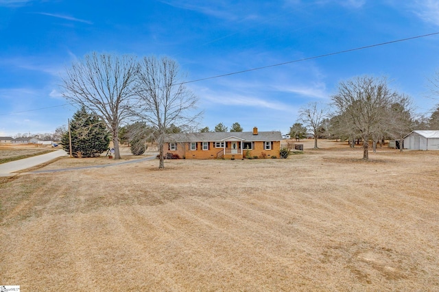 ranch-style house with a chimney