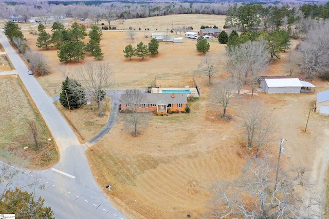 birds eye view of property featuring a rural view