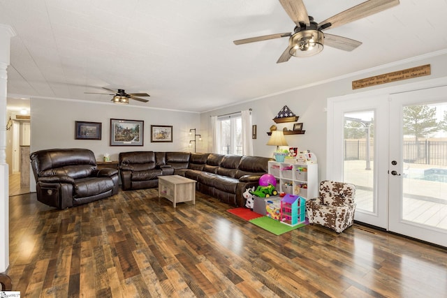 living area with ornamental molding, wood finished floors, french doors, and ceiling fan