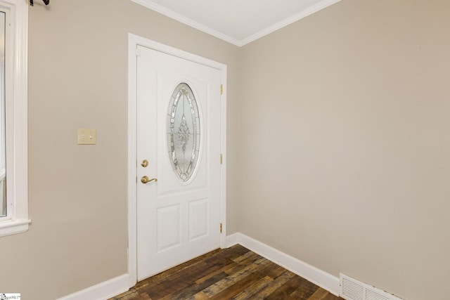 entryway featuring dark wood finished floors, visible vents, baseboards, and ornamental molding