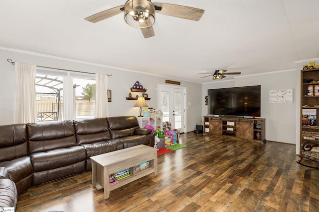 living area with crown molding, a ceiling fan, and wood finished floors