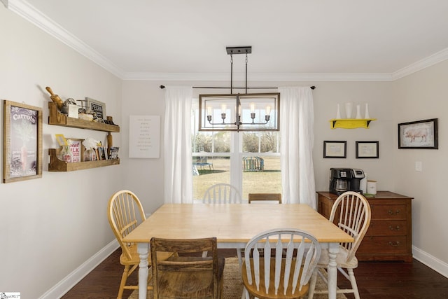 dining space featuring crown molding, baseboards, dark wood-type flooring, and an inviting chandelier