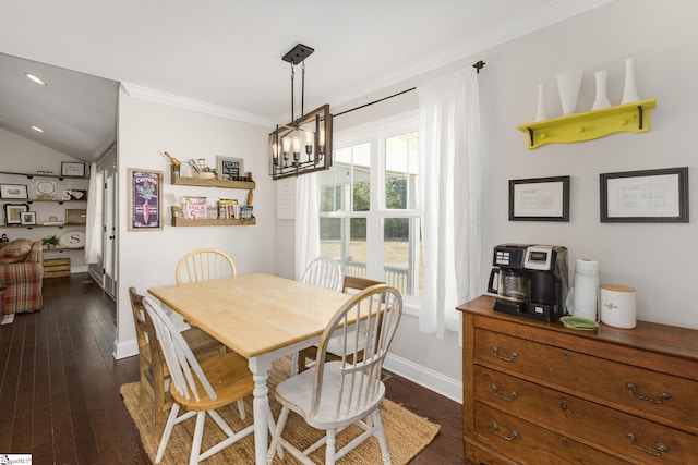 dining space featuring dark wood-type flooring, baseboards, ornamental molding, recessed lighting, and an inviting chandelier