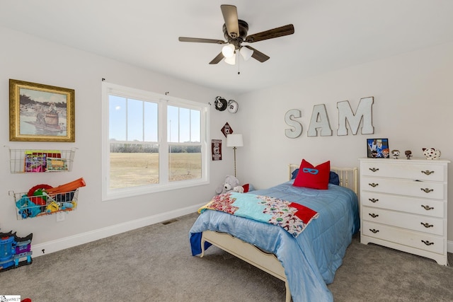 carpeted bedroom with visible vents, ceiling fan, and baseboards