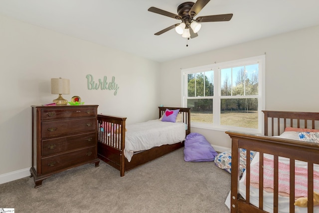 bedroom featuring carpet flooring, ceiling fan, and baseboards