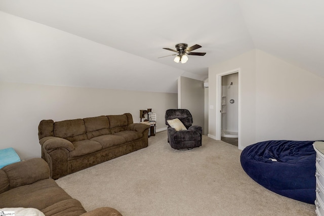 carpeted living room with baseboards, a ceiling fan, and vaulted ceiling