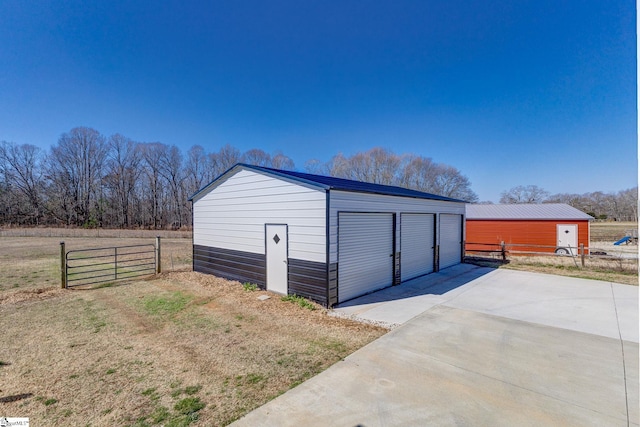 view of outbuilding with an outdoor structure and fence