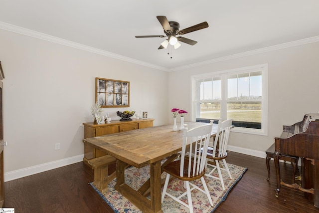 dining room with crown molding, wood finished floors, baseboards, and ceiling fan