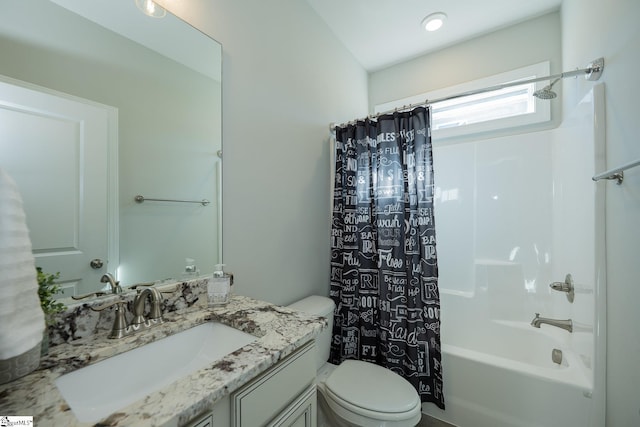 bathroom with shower / bath combination with curtain, toilet, and vanity