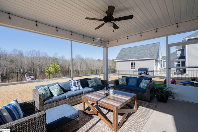 view of patio / terrace featuring grilling area, a ceiling fan, fence, and an outdoor hangout area