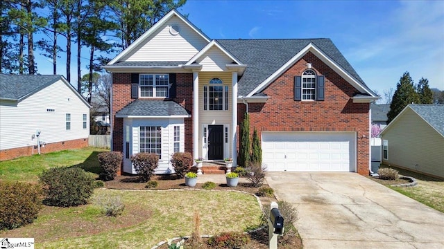 traditional home with brick siding, a front lawn, roof with shingles, a garage, and driveway