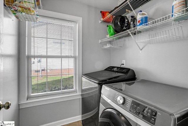 washroom featuring washer and dryer and laundry area