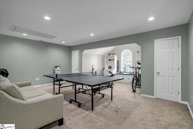 game room featuring light carpet, recessed lighting, attic access, and baseboards