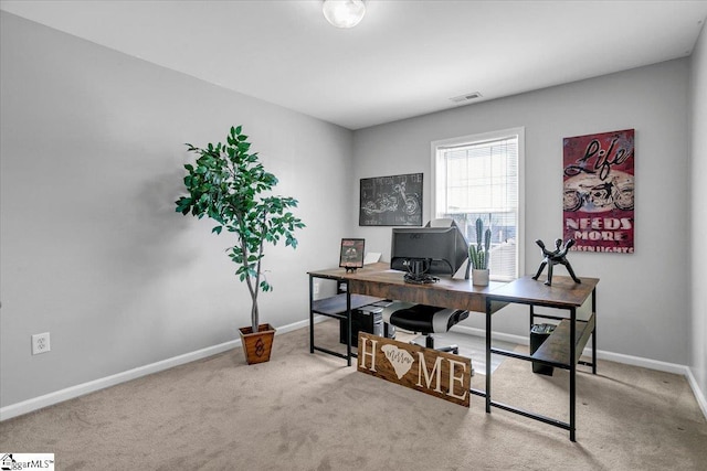 office space with baseboards, carpet floors, and visible vents