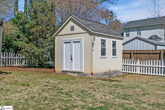 view of shed with fence