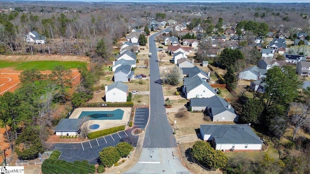 birds eye view of property with a residential view