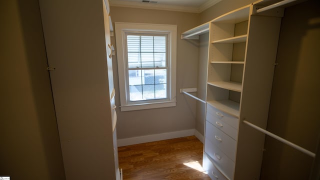 spacious closet with visible vents and wood finished floors