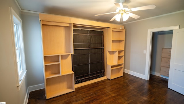 unfurnished bedroom with baseboards, dark wood finished floors, and ornamental molding