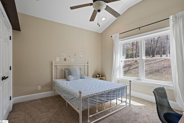 bedroom with multiple windows, carpet flooring, and vaulted ceiling