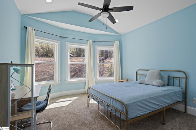 carpeted bedroom featuring baseboards, ceiling fan, and vaulted ceiling