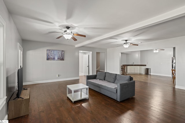 living room with hardwood / wood-style floors, baseboards, and ceiling fan