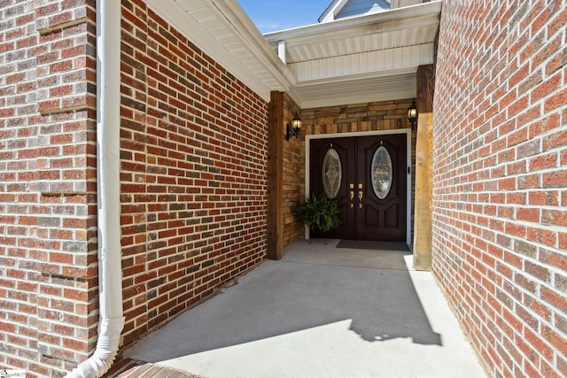 entrance to property with brick siding