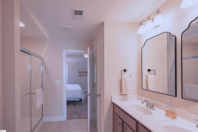 full bath featuring tile patterned floors, a shower stall, ensuite bathroom, and a sink