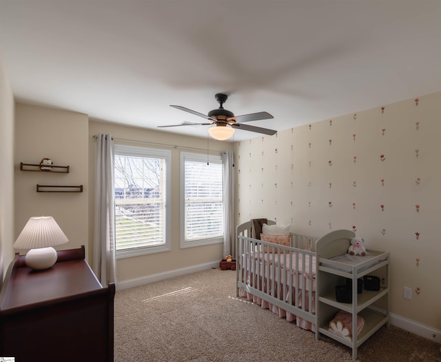 bedroom with ceiling fan, wallpapered walls, baseboards, and carpet floors