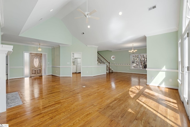 unfurnished living room with visible vents, light wood-style floors, ornamental molding, and stairway