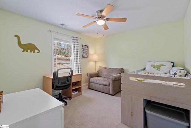 bedroom featuring a ceiling fan, visible vents, and light carpet