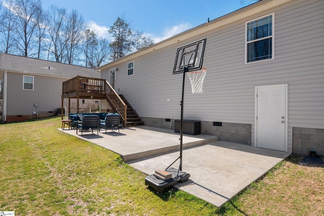 back of property featuring stairs, crawl space, a deck, a patio area, and a lawn