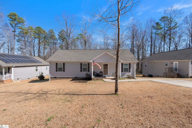 single story home featuring a front lawn, a porch, roof with shingles, crawl space, and driveway